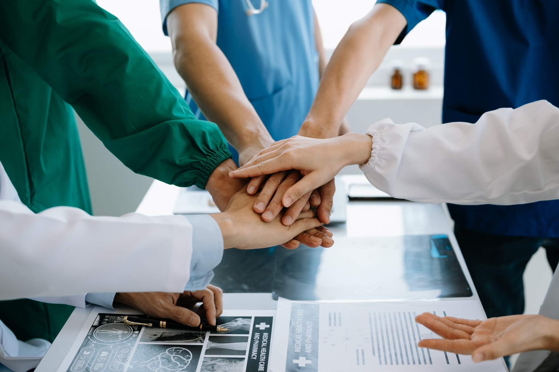 Team Doctors nurses union coordinate hands Teamwork Concept in hospital for success and trust in the team work.